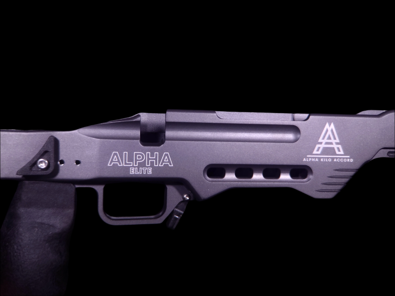 Close-up of the Alpha Chassis in Sniper Grey, featuring the Alpha Kilo Accord branding and vented chassis design