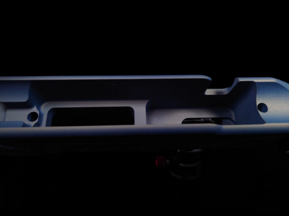 Barrelled action view of the Bravo 22 Chassis in Northern Lights, featuring M-LOK slots and a modular weight system for balance adjustments